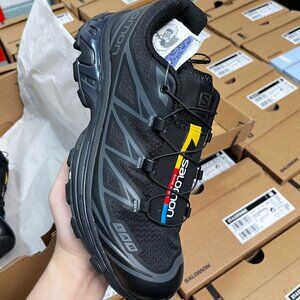 Salomon Black Athletic Shoes with Yellow and Red Accents